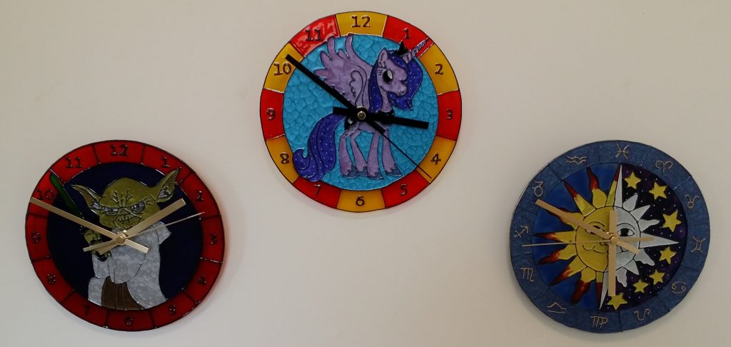 3 Glass Painted Clocks.
